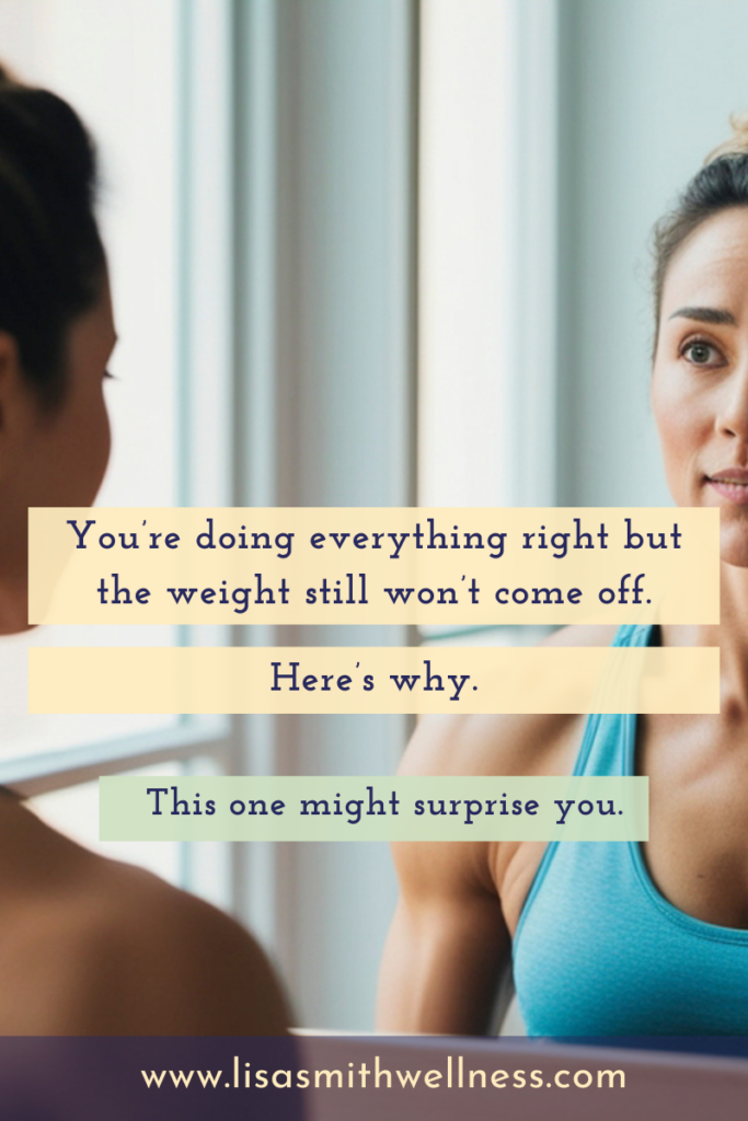 woman staring into a mirror wearing a sports bra. overlay text reads: "You're doing everything right but the weight still won't come off. Here's why. This one might surprise you. www.lisasmithwellness.com"